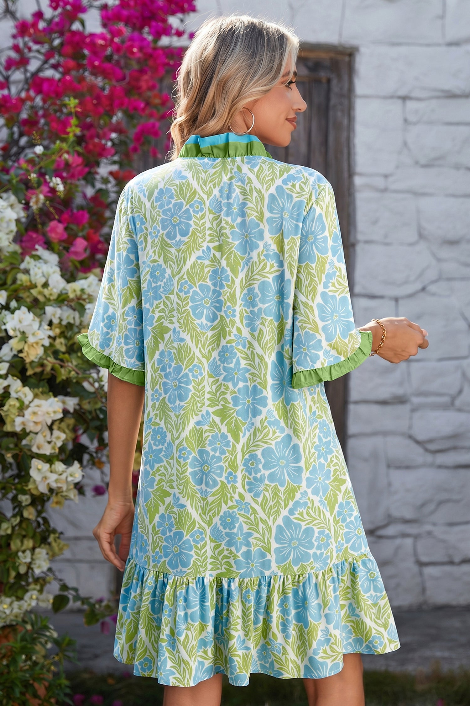 Model in green floral dress with blue flowers and green trim sleeves; size chart shows US 4-6 to 12-14.